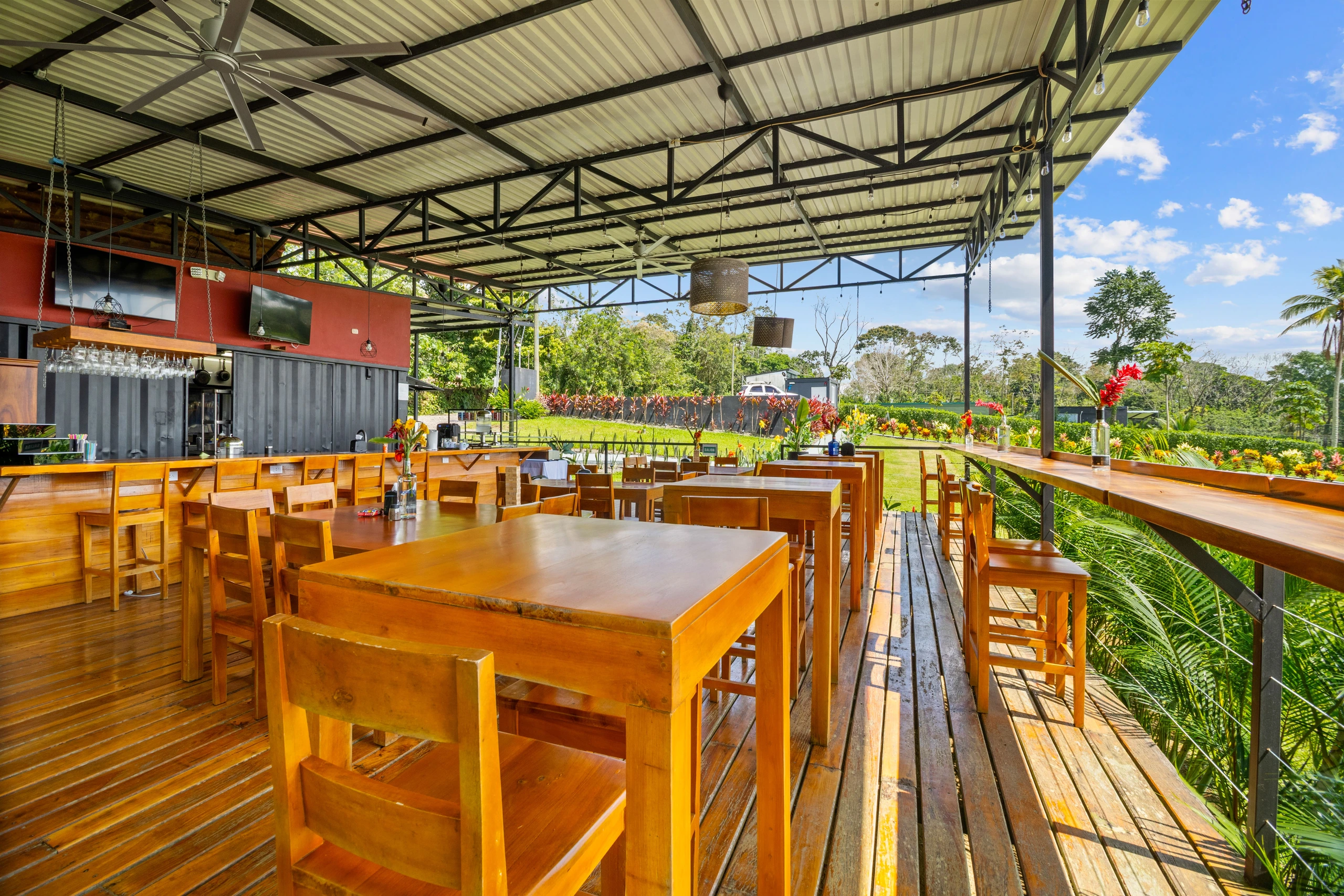 The wooden dining terrace and open-air restaurant at Taste of Agape, Junglo